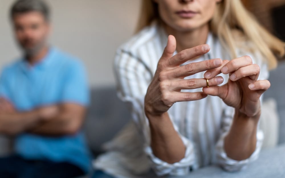 Unhappy Couple Woman Taking ring of from a finger